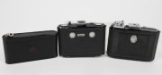 ZEISS IKON: Three vertical folding cameras - one circa 1949 Ikonta 521 [#P 85347] with Tessar 75mm f3.5 lens, one circa 1929 Ikonette 504/12 with Frontar 80mm f9 lens, and one circa 1937 Nettar 515 [#C 44875] with Nettar 75mm f4.5 lens. (3 cameras)  - 9