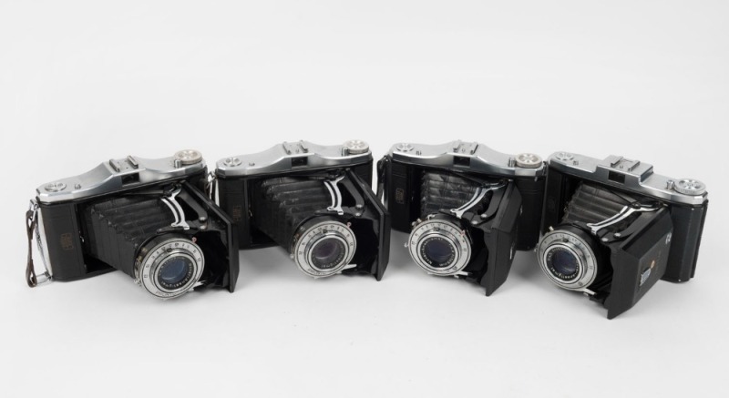 ZEISS IKON: Four Nettar vertical-folding cameras with Novar 105mm f4.5 lenses, together with Velio, Prontor-S, or Pronto shutters. (4 cameras)