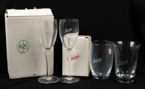 LEITZ: Four Leica-branded drinking glasses, including two wine glasses, in maker's boxes. (4 items)