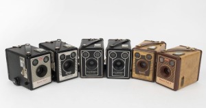 KODAK: A selection of six box cameras, circa 1955, comprising three Six-20 Brownie D models, one Brownie Flash II, one Brownie Flash B, and one Six-20 Brownie Model F. (6 cameras)