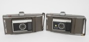 POLAROID: A selection of five instant rollfilm cameras, circa late 1950s, comprising two Polaroid 110A Pathfinder models with viewfinder attachment, two Polaroid J66 models, and one Polaroid 160 model. (5 cameras) - 2