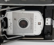 POLAROID: A selection of five instant rollfilm cameras, circa late 1950s, comprising two Polaroid 110A Pathfinder models with viewfinder attachment, two Polaroid J66 models, and one Polaroid 160 model. (5 cameras) - 5