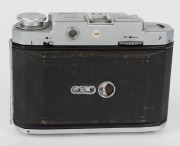 MAMIYA: Mamiya-6 IV horizontal-folding camera [#39191], circa 1951, with Zuiko 75mm f3.5 lens [#39089] and Seikosha-Rapid shutter. 'Made in Occupied Japan' embossed into the leather on the side.  - 6