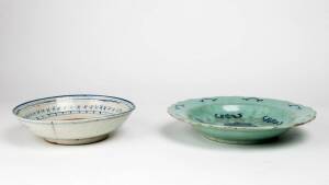 A green glazed under-glaze blue Chinese plate and a blue and white dish, both 19th/20th century, 28.2cm and 22.8cm diameter