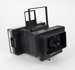 POLAROID: Polaroid M-10 Land Camera [#AC 100459], circa 1972, with hand grip and sports finder attachment.