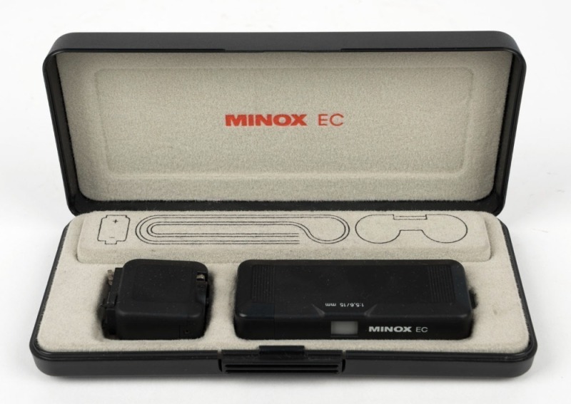 MINOX: Black-body Minox EC subminiature camera [#2 718 533], circa 1981, in black presentation box with FE4 flash unit, battery, and wrist chain.