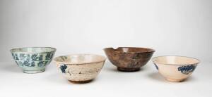 Four Provincial Chinese blue and white large bowls, all decorated in under-glaze blue, circa 19th century, 30.8cm diameter to 22.4cm diameter