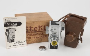 RIKEN OPTICAL: Steky IIIa subminiature camera [#73043 7], circa 1954, with Stekinar 25mm f3.5 lens. Presented in wooden box with leather body casing, metal lens cap, yellow lens filter, and instruction booklet.