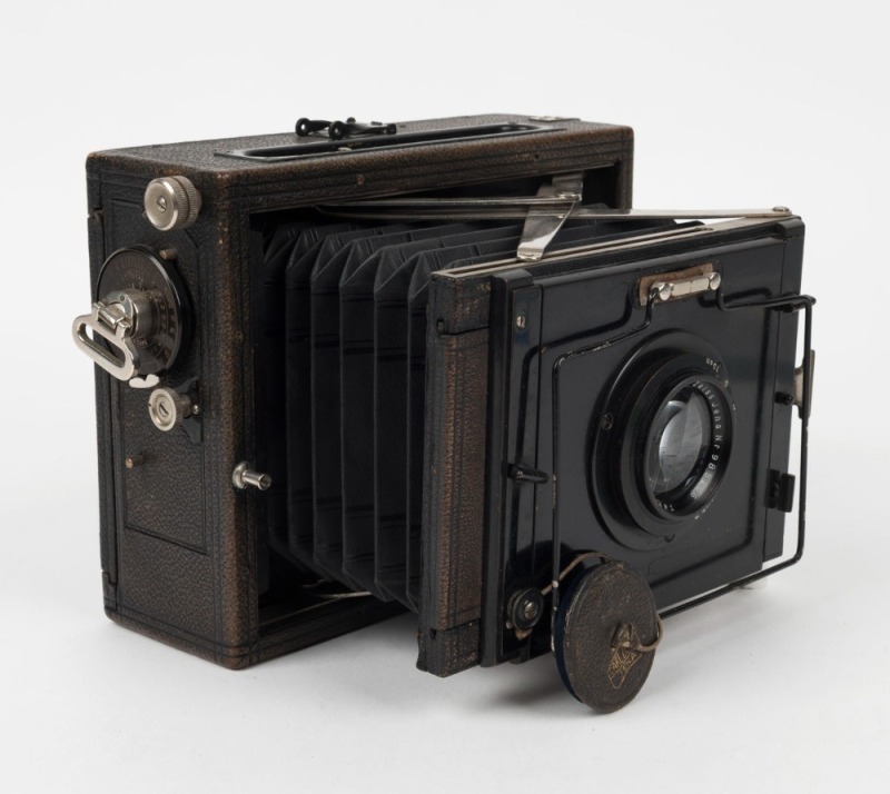 ZEISS IKON: Deckrullo Nettel strut-folding camera [#452121], circa 1928, with Tessar 150mm f4.5 lens [#985256] and leather lens cap.