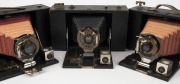 KODAK: Three circa 1910 folding cameras - one Folding Brownie No. 3 with maroon bellows [#48553-F], one Folding Brownie No. 3A also with maroon bellows [#17503], and one Folding Brownie No. 3D with black bellows [#79604F]. (3 cameras) - 2