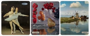 VOIGTLÄNDER: Three Voigtländer point-of-sale advertising placards, featuring photographs of fruit in glass bowls, a ballet performance, and a Dutch landscape with windmill.