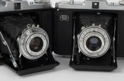 ZEISS IKON: Four circa 1950 horizontal-folding cameras with varying lens and shutter combinations - two Nettar 518/16 [#T 15792 & #J 94349] and two Nettar 517/16 [#V 27720 & #G 34035]. (4 cameras) - 2