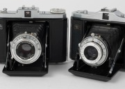 ZEISS IKON: Four circa 1950 horizontal-folding cameras with varying lens and shutter combinations - two Nettar 518/16 [#T 15792 & #J 94349] and two Nettar 517/16 [#V 27720 & #G 34035]. (4 cameras) - 3