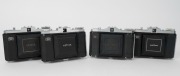 ZEISS IKON: Four circa 1950 horizontal-folding cameras with varying lens and shutter combinations - two Nettar 518/16 [#T 15792 & #J 94349] and two Nettar 517/16 [#V 27720 & #G 34035]. (4 cameras) - 4