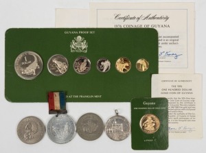 GUYANA: 1976 $100 gold proof on card of issue; 1976 1c - $1 proofs on card of issue; plus two 1970 $1 coins, and two unrelated medals. (11 coins).
