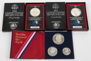 United States of America - Coins1976 $1, 50c & 25c Bicentennial Silver Proof set  in folder; 1983 Olympic $1 (Discus thrower) Proof & 1984 $1 Olympic Stadium Proof, both in original presentation boxes. (3 items).