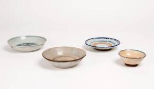 A blue and white phoenix dish, 18th century, 15cm diameter, with two other dishes and a cup, 19th century