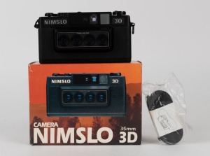 NIMSLO: Nimslo 3D 35mm film camera with 30mm quadra lenses, circa 1980s [#320570164], in original packaging. Made in Japan.