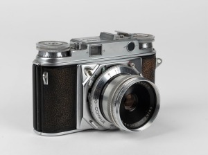 VOIGTLÄNDER: 1954 Prominent rangefinder camera [#B38086], with Color-Skopar 50mm f3.5 lens [#3679039], Synchro-Compur shutter, and accessory shoe. 