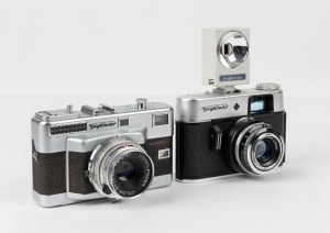 VOIGTLÄNDER: Two rangefinder cameras - one 1957 Vitessa T with Color-Skopar 50mm f2.8 lens [#4381235], and one 1963 Vitoret R [#197591] with Lanthar 50mm f2.8 lens and AG1 flashgun attachment. (2 cameras)