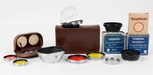 VOIGTLÄNDER: Various camera accessories of various sizes, including a matching set of two lens filters and lens hood presented in limited-edition leather pouch marked '90/093', six packaged lens filters of sizes ranging from 32mm to 37mm, and two lens hoo