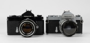 NIPPON KOGAKU: Two circa 1967 Nikon Nikkormat FT SLR cameras -&nbsp;one [#FT 3662869] with black body and&nbsp;Nikkor-S&nbsp;Auto 50mm f1.4 lens [#691425], the other [#FT 3162164] with Nikkor-H&nbsp;Auto 50mm f2 lens [#2040973] and lens cap. - 2
