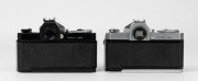 NIPPON KOGAKU: Two circa 1967 Nikon Nikkormat FT SLR cameras -&nbsp;one [#FT 3662869] with black body and&nbsp;Nikkor-S&nbsp;Auto 50mm f1.4 lens [#691425], the other [#FT 3162164] with Nikkor-H&nbsp;Auto 50mm f2 lens [#2040973] and lens cap. - 3