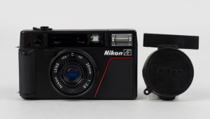 NIPPON KOGAKU: 1983 Nikon L35 AF point-and-shoot camera [#0927641] with 35mm f2.8 lens and plastic lens cap.