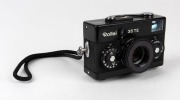 FRANKE & HEIDECKE: Black-body&nbsp;Rollei 35TE compact camera, circa 1980, with Tessar&nbsp;40mm f3.5 lens, rubber lens hood, and wrist strap.&nbsp;