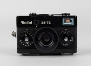 FRANKE & HEIDECKE: Black-body&nbsp;Rollei 35TE compact camera, circa 1980, with Tessar&nbsp;40mm f3.5 lens, rubber lens hood, and wrist strap.&nbsp; - 2