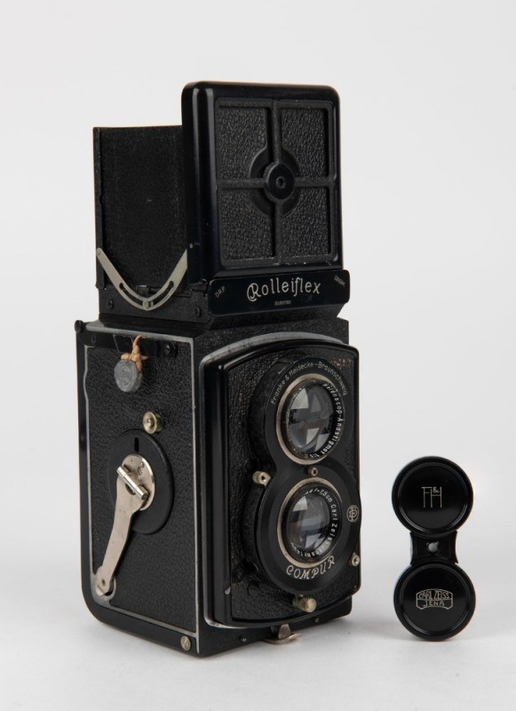 FRANKE & HEIDECKE: Circa 1933 Rolleiflex Old Standard TLR camera [#301765] with Tessar 75mm f3.8 lens [#1450430] and metal lens cap, with directions in French on rear.