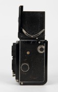 FRANKE & HEIDECKE: Circa 1933 Rolleiflex Old Standard TLR camera [#301765] with Tessar 75mm f3.8 lens [#1450430] and metal lens cap, with directions in French on rear. - 3