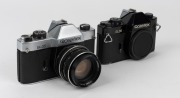 FRANKE & HEIDECKE: Two Rolleiflex SL35 SLR cameras, circa 1970, one [#4004994] made in Germany with chrome-body&nbsp;and Planar 50mm f1.8 lens [#5190066], and one [#4038628] with body only, in black, made in Singapore. (2 cameras)