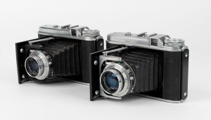 VOIGTLÄNDER: Two vertical-folding cameras - one 1950 Perkeo II with Color-Skopar 80mm f3.5 lens [#3073566] and Synchro-Compur shutter, and one 1949 Perkeo I with Color-Skopar 80mm f3.5 lens [#3073566] and Synchro-Compur shutter. (2 cameras)