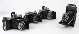 HOUGHTON: Four folding cameras - one Ensign Ranger [#D16430], two Selfix 820 Specials [#243244 & #261683], and one Ensign Autorange 220 [#4851]. (4 cameras)