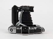 ZEISS IKON: Super Ikonta C 531/2 vertical-folding camera [#P 10820], circa 1950, with Tessar 105mm f3.5 lens [#87064]. - 4