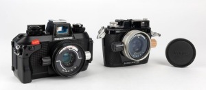 NIPPON KOGAKU: Two Nikonos underwater cameras - one 1969 Nikonos II with W-Nikkor 35mm f2.5 lens [#194396] and front lens cap, and one Nikonos IVa with Nikkor 35mm f2.5 lens [#473318].