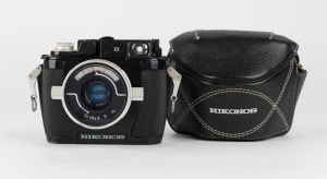 NIPPON KOGAKU: Nikonos II underwater camera [#1029148], circa 1969, with W-Nikkor 35mm f2.5 lens [#312071], together with original leather zip-case and wrist strap. Designed by oceanographer Jacques Cousteau.