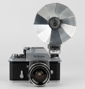 NIPPON KOGAKU: Nikon F&nbsp;Photomic&nbsp;T SLR&nbsp;camera [#6766494], circa 1965, with Nikkor-S Auto 35mm f2.8 wide-angle lens [#371067], Photomic T metering prism, and Nikon F BC-7 flash unit attachment. - 2