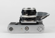 NIPPON KOGAKU: Nikon F&nbsp;Photomic&nbsp;T SLR&nbsp;camera [#6766494], circa 1965, with Nikkor-S Auto 35mm f2.8 wide-angle lens [#371067], Photomic T metering prism, and Nikon F BC-7 flash unit attachment. - 5