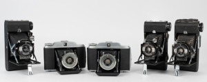 KERSHAW: Five mid-century, English-made folding cameras - three Eight-20 Penguins, and two Kershaw 110s. (5 cameras)