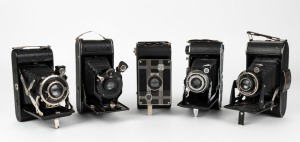 VARIOUS MANUFACTURERS: A selection of early 20th-century vertical-folding cameras, comprising models from Contessa-Nettel, Ferrania, Houghton, Kodak, and Voigtländer. (5 cameras)