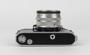 KAMERA-WERKST&Auml;TTEN: Circa 1958 Praktina IIa SLR camera [#107 565] with Flexon 50mm f2 lens {#5471997] and front lens cap. Together with maker's box, leather body casing, lens hood, rapid-wind lever accessory, and instruction booklet. - 6