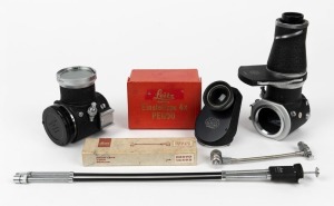 LEITZ: Various interlocking Leica camera accessories, circa early 1950s, including two OZUPO Visoflex I housings, one PEGOO 4x magnifier in red maker's box, one OZXVO cable release in maker's box, and one OZWTO double cable release. (5 items)