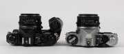 ASAHI KOGAKU: Two circa 1980 Pentax ME Super SLR cameras - one black-body with SMC Pentax-M 50mm f2 lens [#4792018] and Pentax Winder ME II attachment, the other in chrome [#2746139] with SMC Pentax-M 50mm f1.7 lens [#6560690]. (2 cameras) - 4