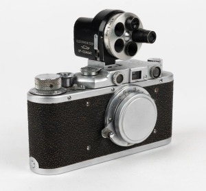 FED: Fed-1g Leica-copy rangefinder camera [#711147], circa 1955, with Fed 50mm f3.5 lens, metal lens cap, and finder attachment.