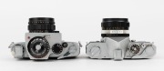 KONICA: Two SLR cameras - one 1968 Autoreflex T [#774793] with Hexanon&nbsp;52mm f1.8 lens [#7451318], and one 1962 FP [#3744155] with Hexanon&nbsp;52mm f1.4 lens [#4132705], front lens cap, and exposure meter attachment. (2 cameras) - 4