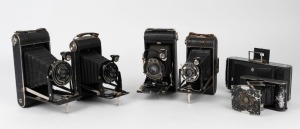 KODAK: A selection of six different vertical-folding cameras, with various lens and shutter combinations. (6 cameras)