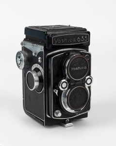 YASHICA: Circa 1958 Yashica-635 dual format TLR camera [#5990118], with Yashikor 80mm f3.5 lens [#524534] and metal front lens cap.