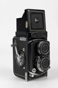 MINOLTA: Minolta Autocord RG TLR camera [#365314], circa 1961, with Rokkor 75mm f3.5 lens [#2447051] and Citizen-MVL shutter, together with metal lens cap.